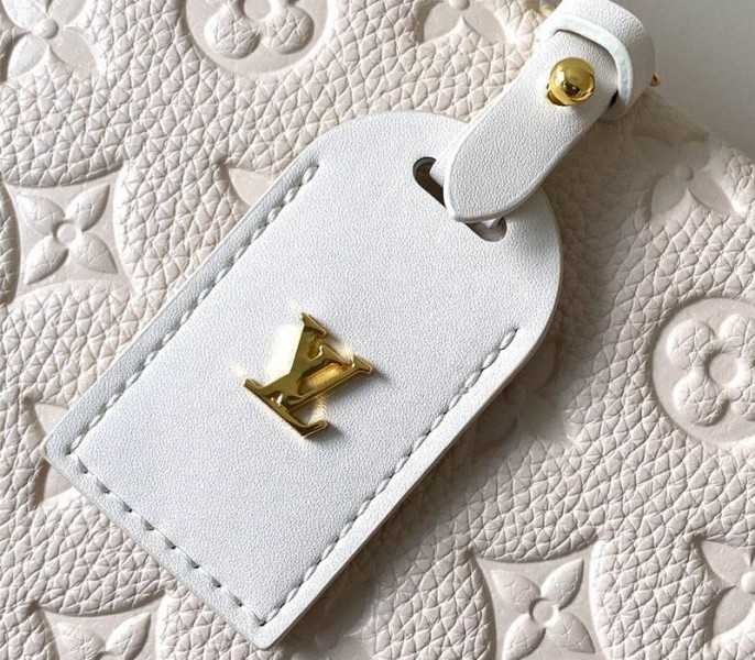 L0vis Vvtt0n Monogram Empreinte Petite Malle Souple Handbag In Cream
