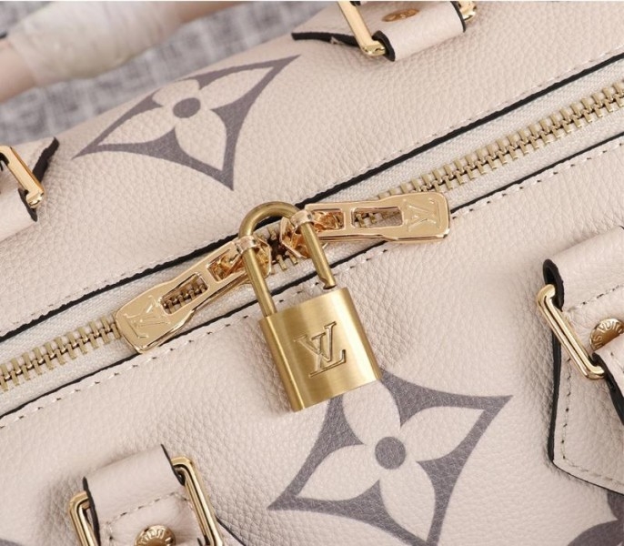 L0vis Vvtt0n Bicolor Monogram Empreinte Leather Speedy Bandouliere 25 Handbag In Cream And Bois De Rose Pink