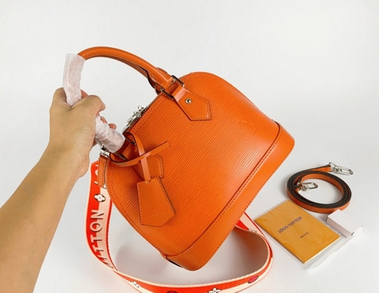 L0vis Vvtt0n Epi Leather Alma BB Handbag In Orange With Jacquard Strap