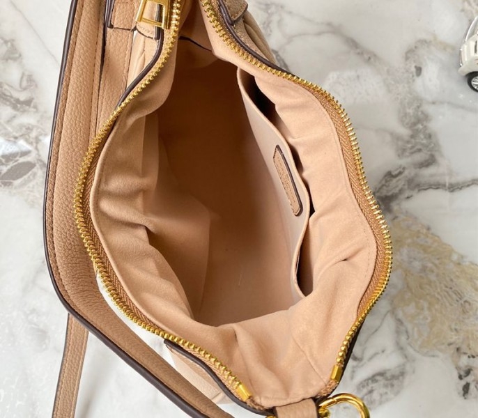 L0vis Vvtt0n Monogram Empreinte Leather Bagatelle Mini Hobo In Beige