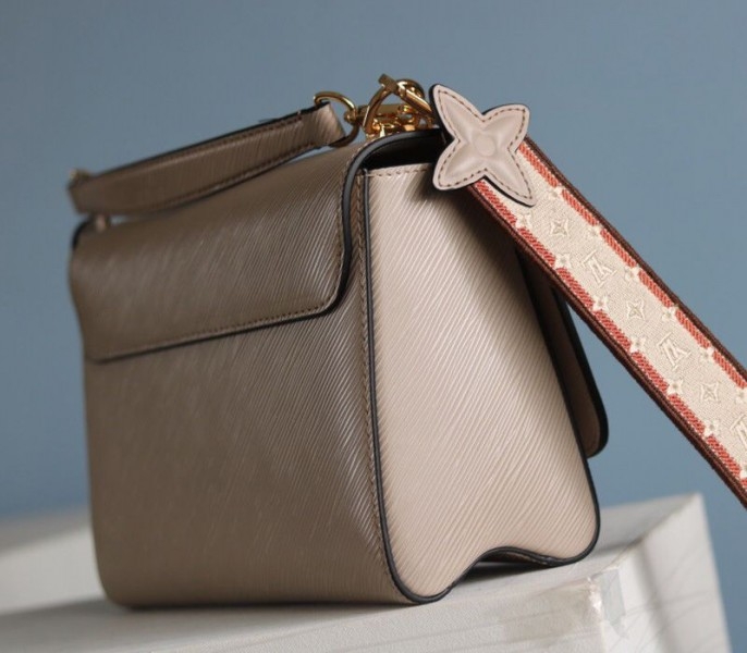 L0vis Vvtt0n Epi Leather Twist MM Handbag In Galet Gray With Embroidered Strap