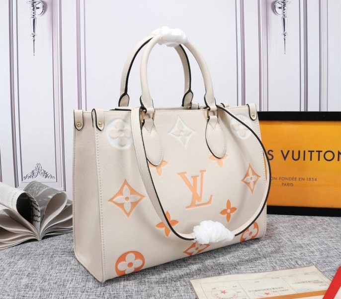 L0vis Vvtt0n Monogram Empreinte Leather Onthego MM Bag In Cream Saffron