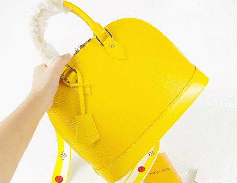 L0vis Vvtt0n Epi Leather Alma PM Handbag In Cedrat Yellow With Jacquard Strap