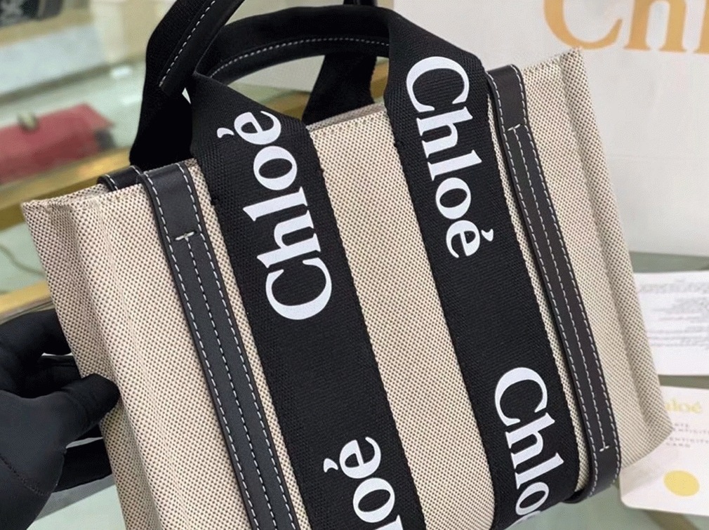 Top Quality Replica Chloe Small Woody Tote Bag in Canvas with Black Leather Strips