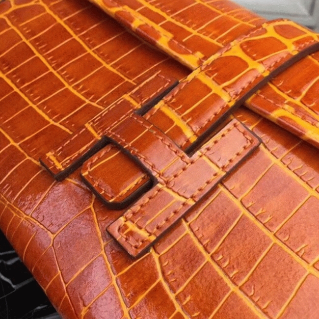 Orange crocodile leather knockoff H**me5 Jige Elan clutch bag