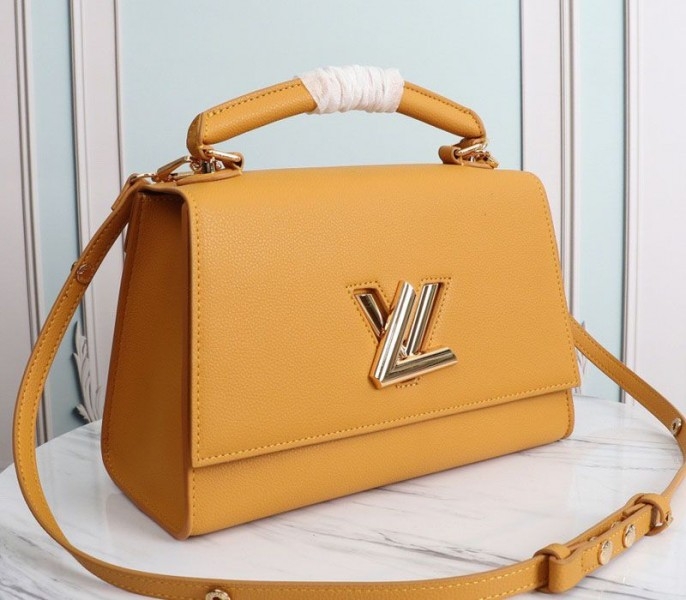 L0vis Vvtt0n Twist One Handle MM Handbag In Vibrant Honey