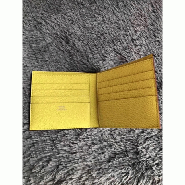 Yellow knockoff H**me5 Copernic compact wallet