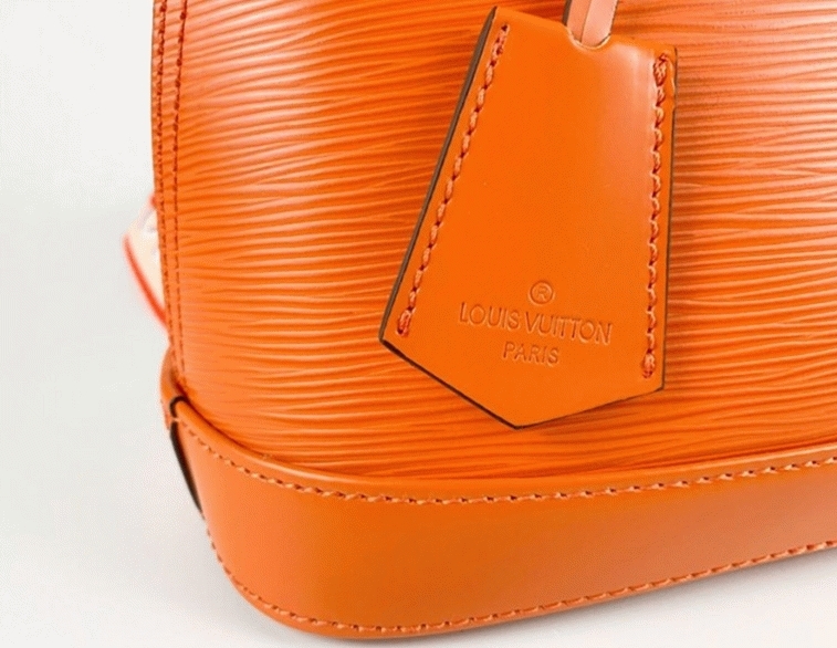 L0vis Vvtt0n Epi Leather Alma BB Handbag In Orange With Jacquard Strap