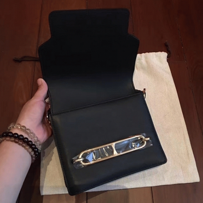 Black knockoff H**me5 Mini Sac Roulis handbag